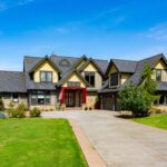 Luxurious home exterior at 5841 Willow Springs Way, Ferndale, with manicured lawns and elegant stonework, listed by Andi Dyer