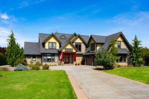 Luxurious home exterior at 5841 Willow Springs Way, Ferndale, with manicured lawns and elegant stonework, listed by Andi Dyer