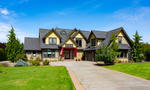 Luxurious home exterior at 5841 Willow Springs Way, Ferndale, with manicured lawns and elegant stonework, listed by Andi Dyer