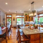 Gourmet kitchen featuring a large island and rich wooden cabinetry at 5841 Willow Springs Way, listed by Andi Dyer