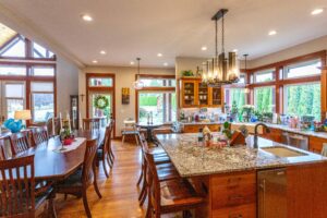 Gourmet kitchen featuring a large island and rich wooden cabinetry at 5841 Willow Springs Way, listed by Andi Dyer