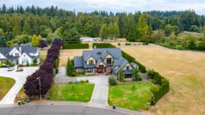 Aerial view showcasing the expansive property and surrounding greenery at 5841 Willow Springs Way, Ferndale, listed by Andi Dyer