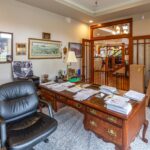 Elegant home office with classic wood furniture and open layout to the rest of the home, listed by Andi Dyer