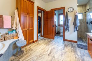 Well-appointed bathroom with extensive counter space and integrated storage solutions, listed by Andi Dyer